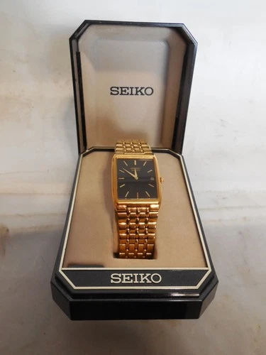 Seiko Tank Watch Men 27mm Black Dial Gold Tone Date 7N29-5B29 New Bat. OEM Box
