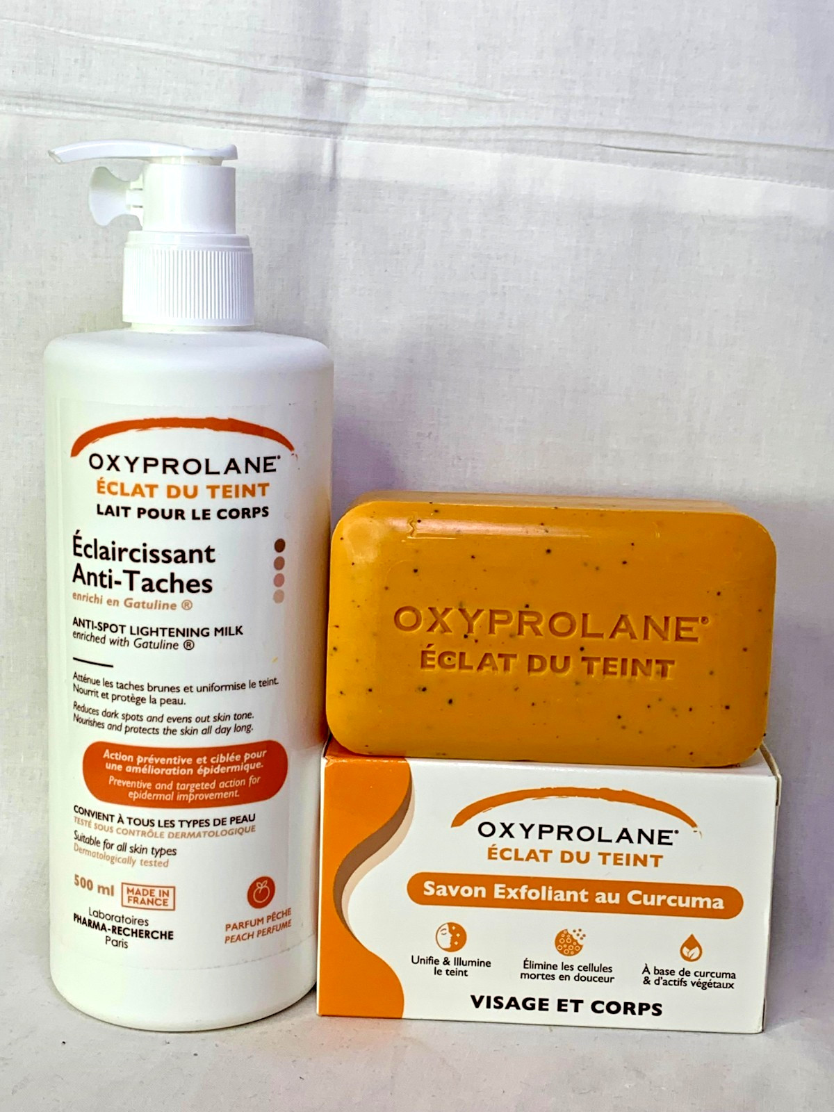 Lait corporel anti-tache Oxyprolane Éclat du Teint et son savon exfoliant gommant unifiant