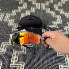 Oakley OO9208 Radar EV Path Sunglasses Clear Gray Frame Prizm Orange Lens
