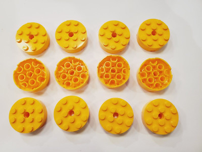 12x - LEGO Bright Light Orange Brick, Round 4 x 4 with Hole (87081) new