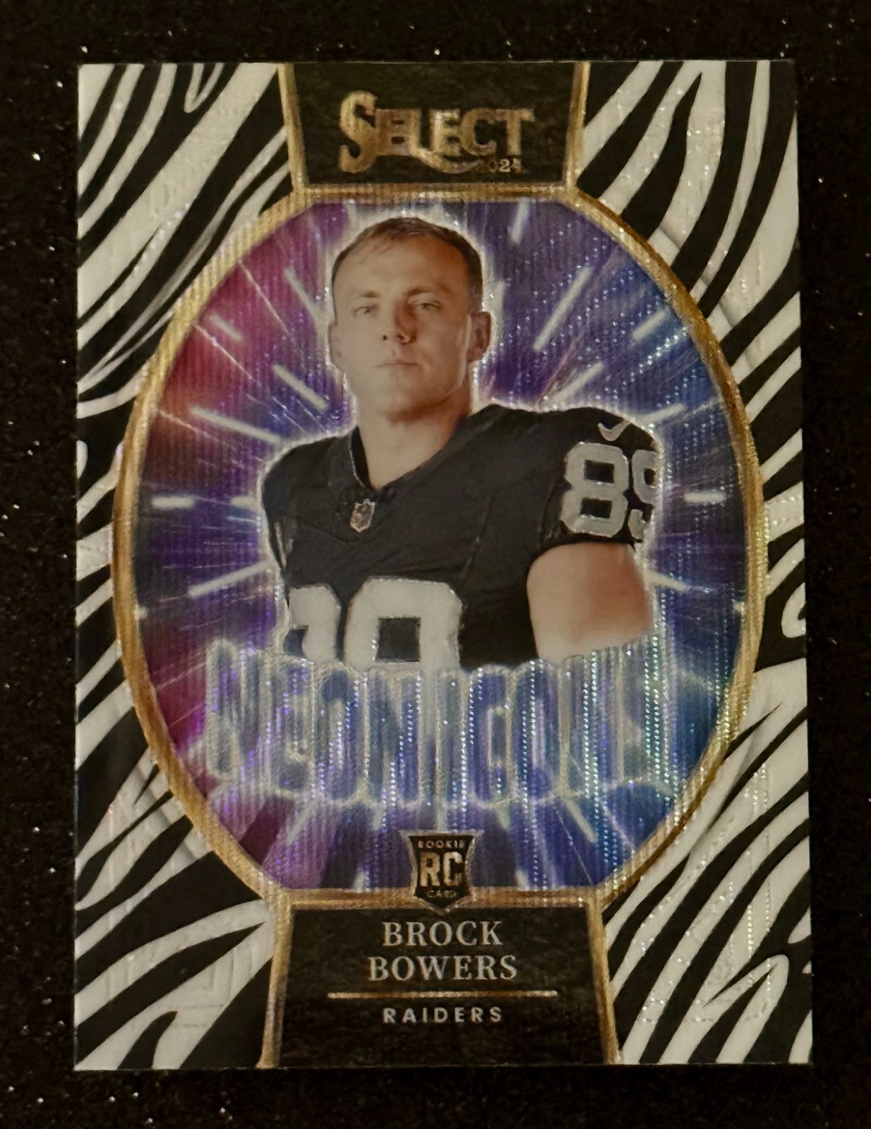 Brock Bowers Zebra Neon Icons - 2024 Panini Select - #16 (RC) Case Hit SS
