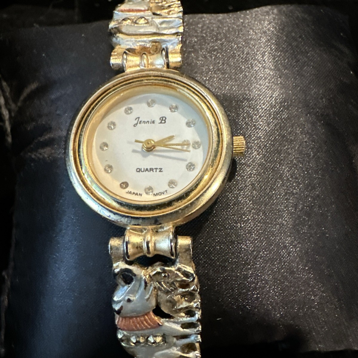 Jennie B White Pearlized Dial Round Gold Tone Case Elephant Charm Bracelet  Watch