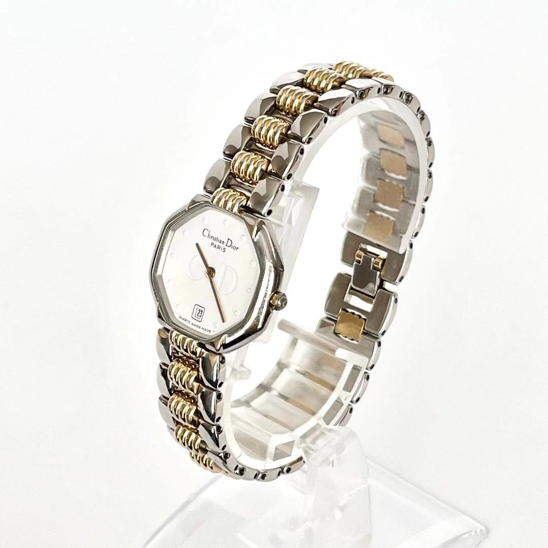 Montre analogique femme Christian Dior 1951 cadran blanc quartz doré pile remplacée