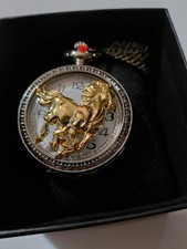 silver and gold horse pocket watch