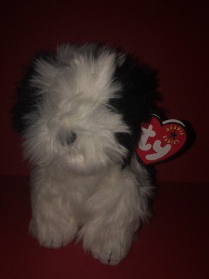 white fluffy stuffed dog