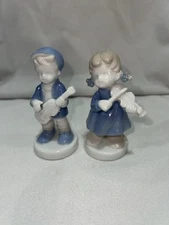 2 Small Children Playing Stringed Instruments