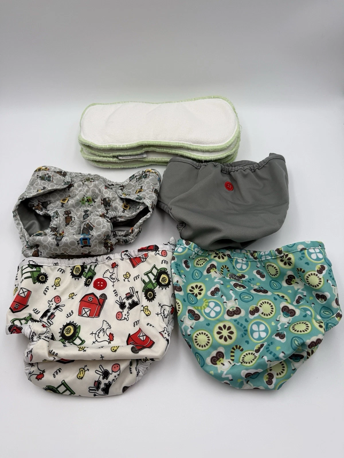 4 Cloth Diapers & Inserts Lot- Buttons Brand - Farm, Robots, Monkeys, & Gray
Opens in a new window o