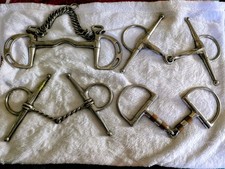 Lotto di 4 - Snaffles: Kimberwick, guancia piena e anello a D con catena a torsione in rame