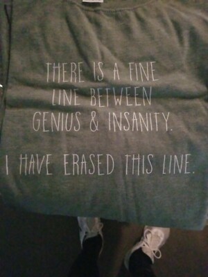 Sentiment T-shirt size XL.  Says, ''There is a fine Line between genius & ins...''