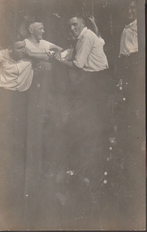 RPPC of a group of men involved in hazing