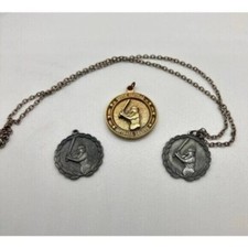 Three vintage women's South Central Softball League medals