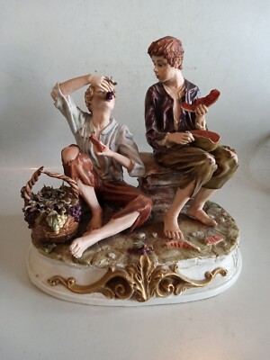 Handcrafted Italian ceramic brothers enjoying watermelon.by D. Bonalberh. 10×8