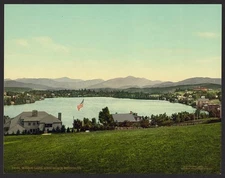 Mirror Lake,pond,homes,American flag,Adirondack Mountains,New York,NY,c1902