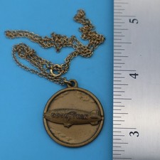 VTG GOODYEAR TIRE BLIMP ROUND BRASS FOB PENDA...