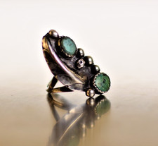 Native American Zuni sterling silver ring with turquoise stones.