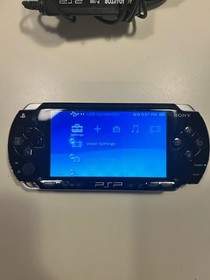 Sony PSP Console w/ AC Adapter, Memory Stick Duo, UMD Games & Movies