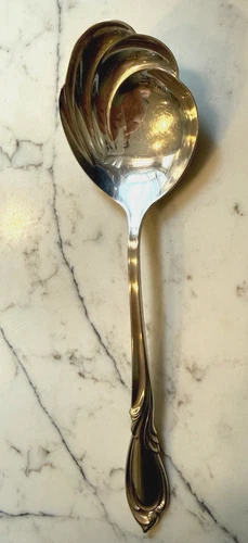 INTERNATIONAL STERLING SILVER  Rhapsody Pierced Olive Spoon 8”