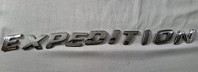 03/06 FORD ''EXPEDITION'' REAR CHROME EMBLEM. USED OEM. REFURBISHED 