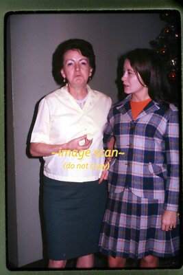 Woman eating a Deviled Egg at Christmas in 1967, Kodachrome Slide aa 28-7a