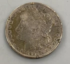 1890 CC Carson City Morgan Silver $1 cleaned bent rim damage L24276