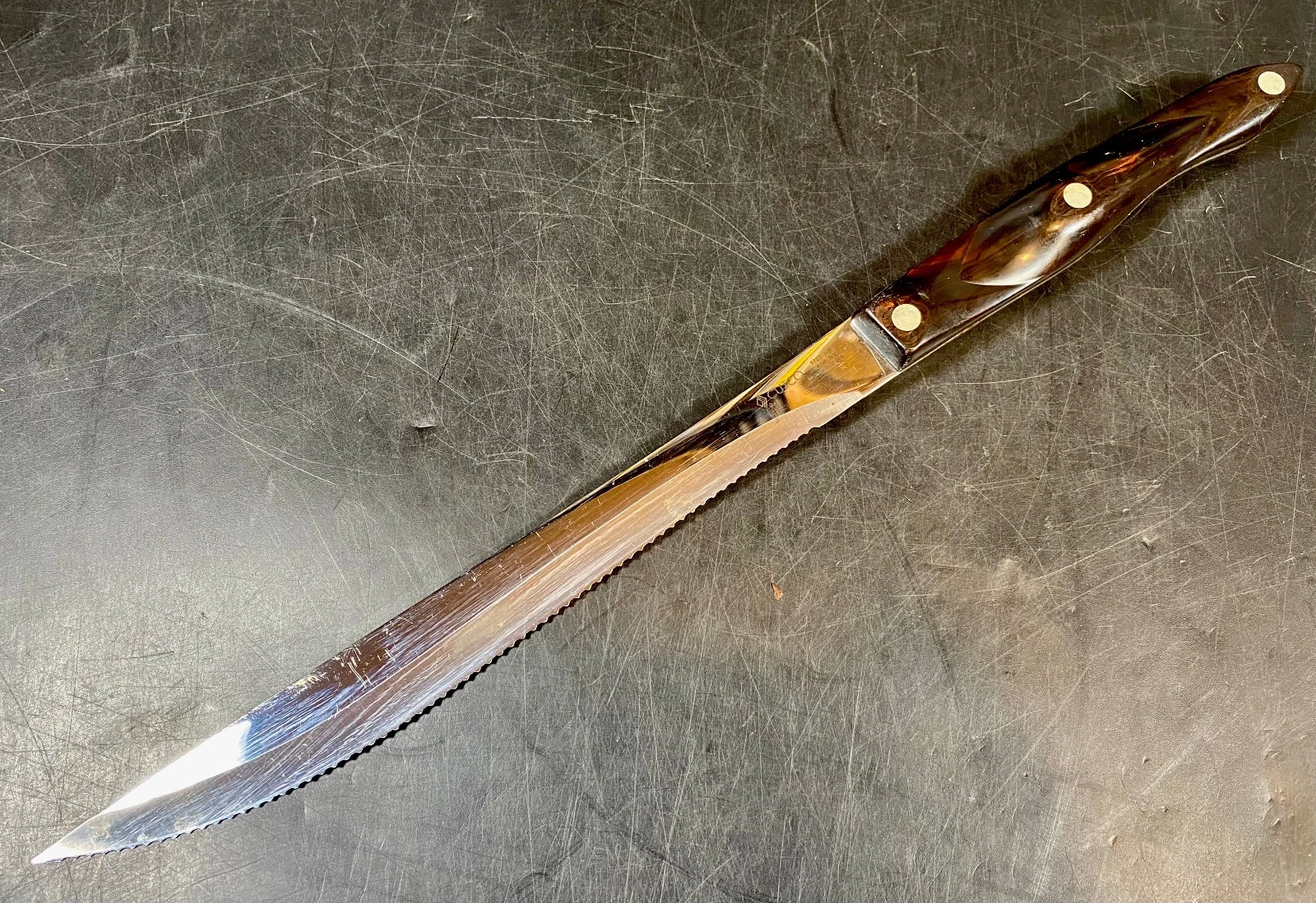 Cutco #1723 Long Serrated Carving Knife with Brown Swirl Handle