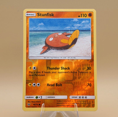 Stunfisk | 46/73 | Common | Rev Holo | Shining Legends | Store Promo Eligible