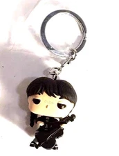 WEDNESDAY ADDAMS 3D KEY CHAIN IN BLACK DRESS, PLAYING CELLO, SITTING IN CHAIR