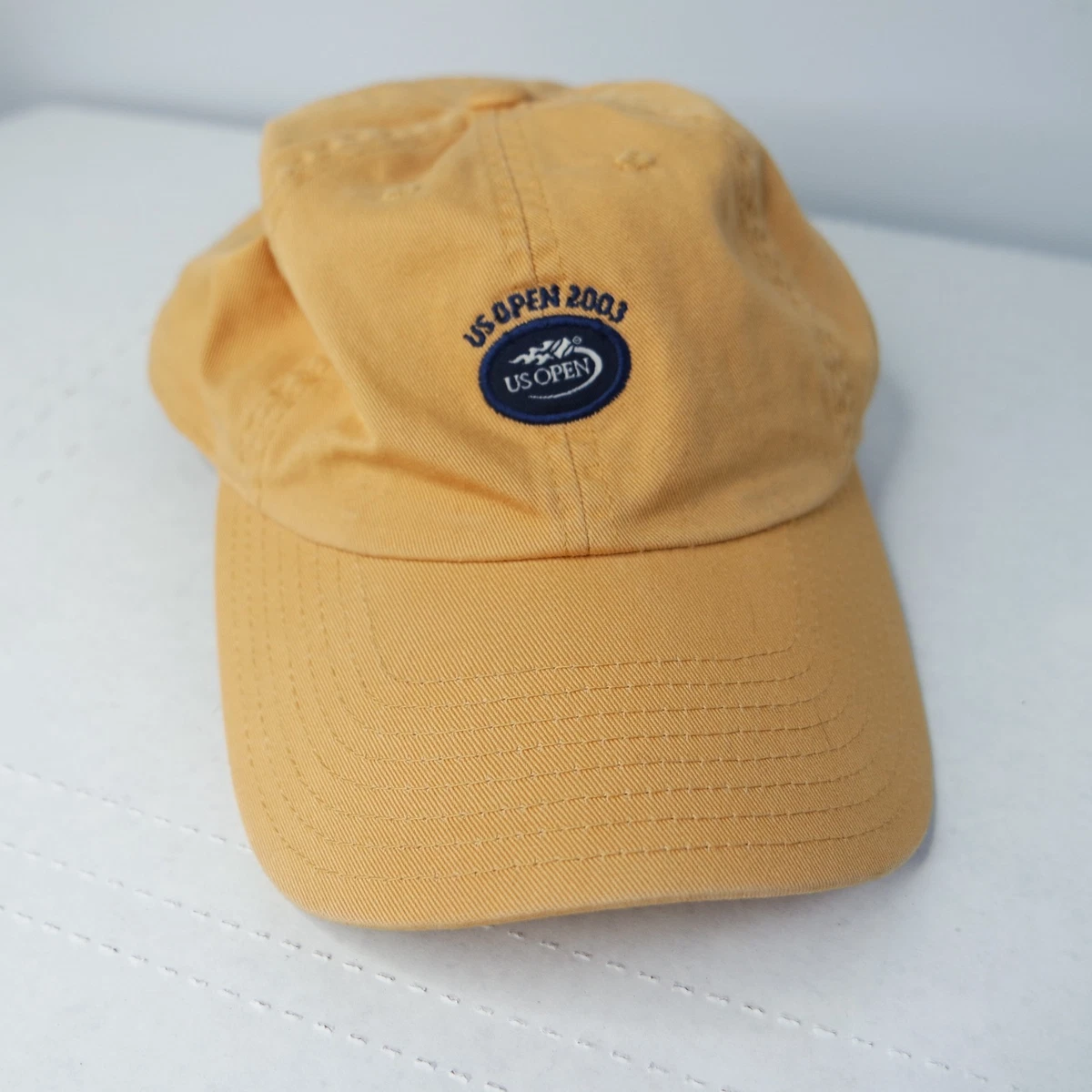 Casquette strapback en coton bleue marine unie avec une broderie sur le côté NEW ERA - CCV Mode