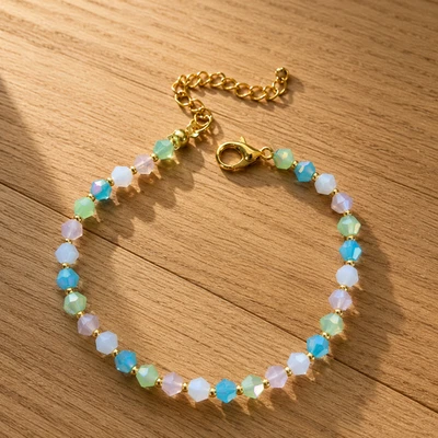 Bracelet femme perles rondes facettées bleu pastel vert d’eau réglable fait main - Photo 1/2