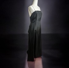 long, black strappy dress, likely made of satin