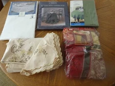 TABLECLOTHS-2- 70" ROUND-BLACK & GREEN/2- OBLONG-WHITE & EMBRODERIED/1-HOLIDAY