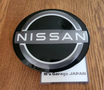 Nissan Genuine New design CI Front Grille Radar Emblem 62890-7FW0B