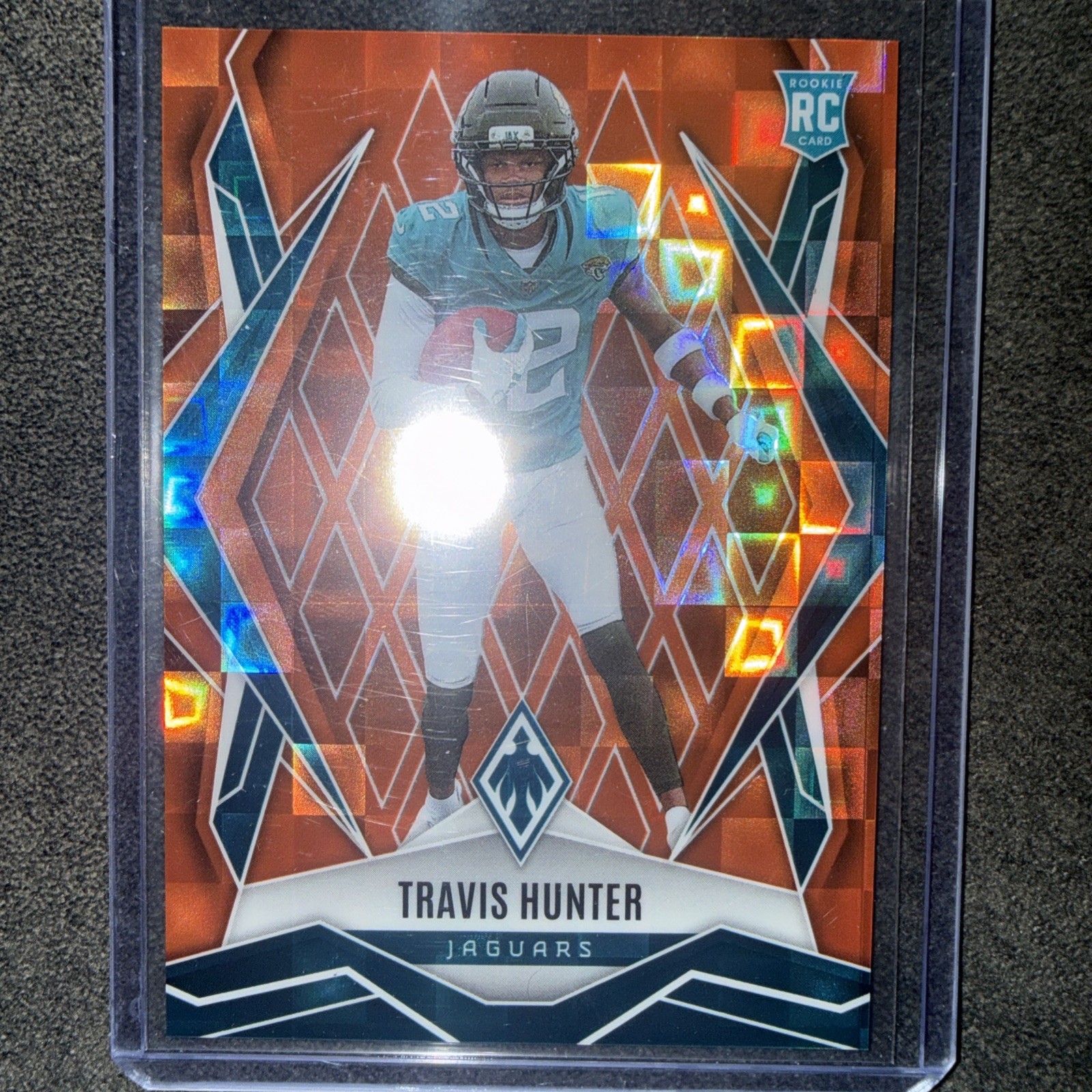 2025 Panini Phoenix - Rookies Travis Hunter #157 Orange Pandora /189 (RC)
