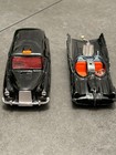 Corgi Batmobile & Iconic die-cast London Taxi with open doors .