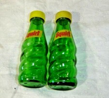 Pair Green Squirt Salt & Pepper Shakers with yellow plastic lids           #1578