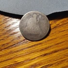 Seated Liberty Quarter as pictured.