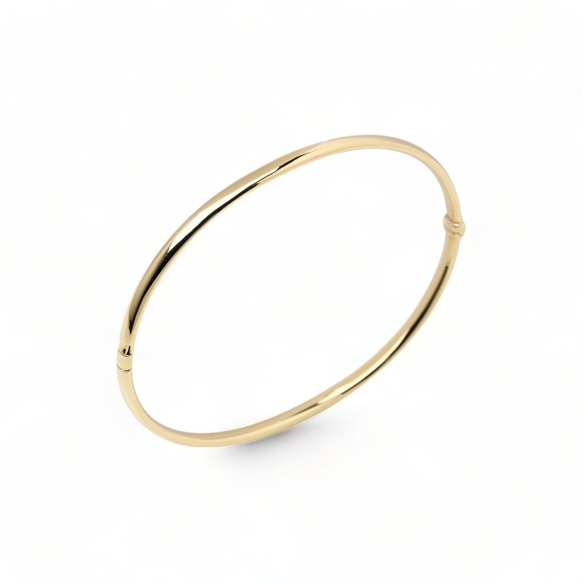 9ct gold CZ oval hinged bangle. 9ct gold CZ oval hinged bangle.