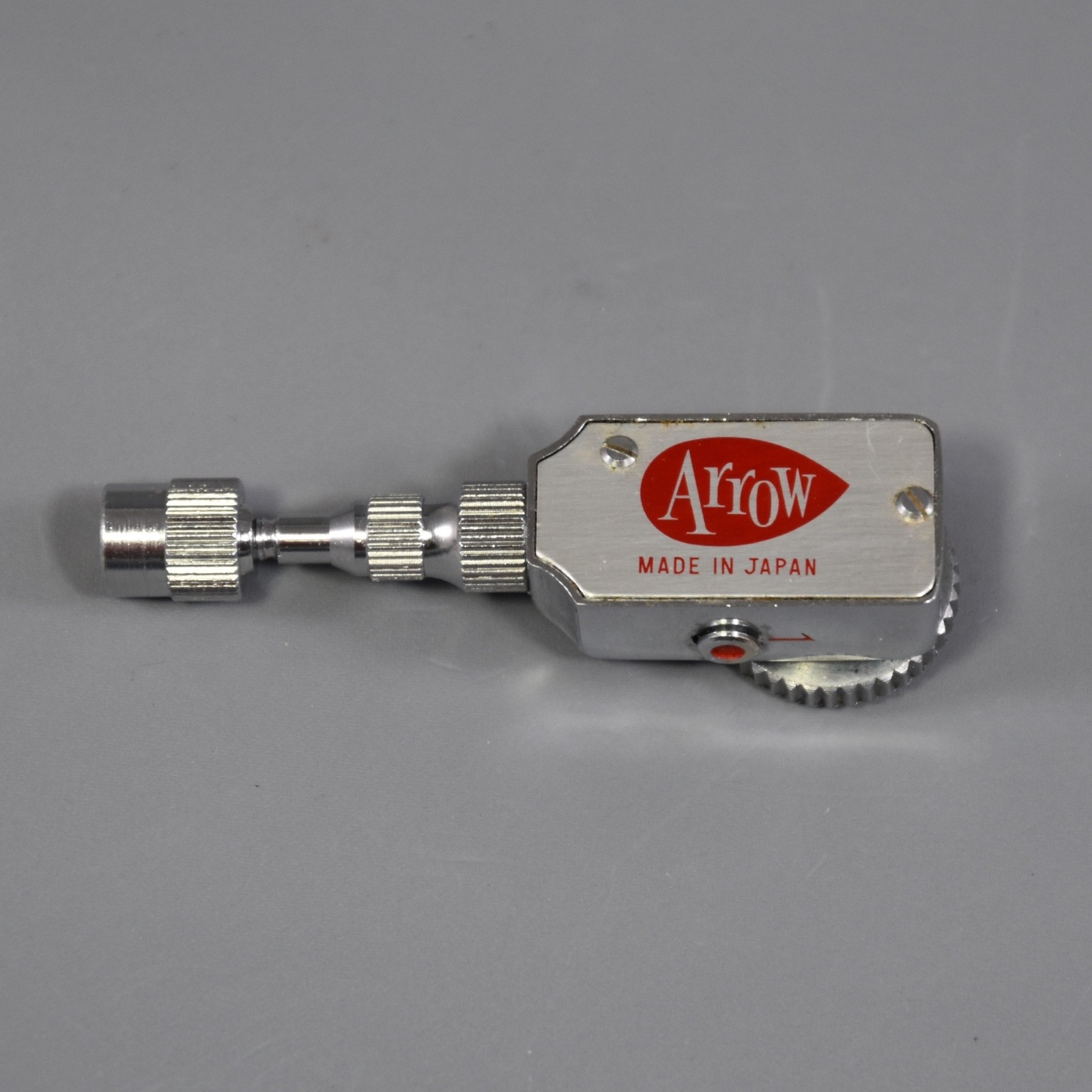 Vintage Arrow brand mechanical self-timer for a film camera.