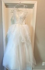 White shiny ball gown wedding dress 