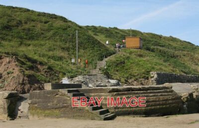 FOTO ZUGANG ZUM STRAND CAYTON BAY SANDWICHES GETRÄNKE EISCREME UND STRANDAUSRÜSTUNG DOSE B