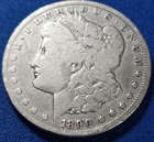 A 1890 CC MORGAN SILVER DOLLAR