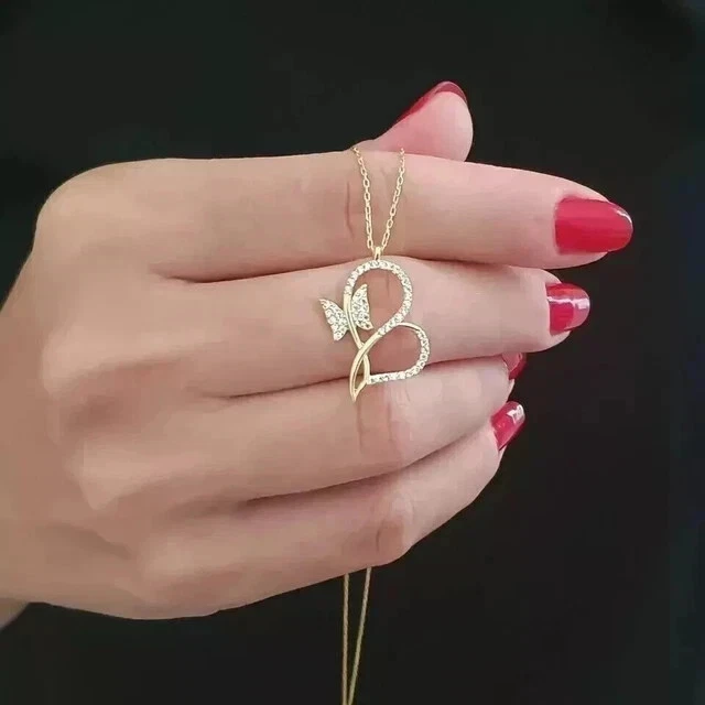 Colgante de corazón de diamantes de corte redondo de 2 quilates creado en laboratorio enchapado en oro amarillo de 14 k Foto 2 de 4