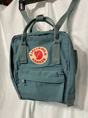 Fjallraven Kanken mini backpack in sage green adjustable straps, zip pocket