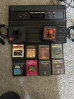 Atari 2600 console 2 joysticks & 8 games untested