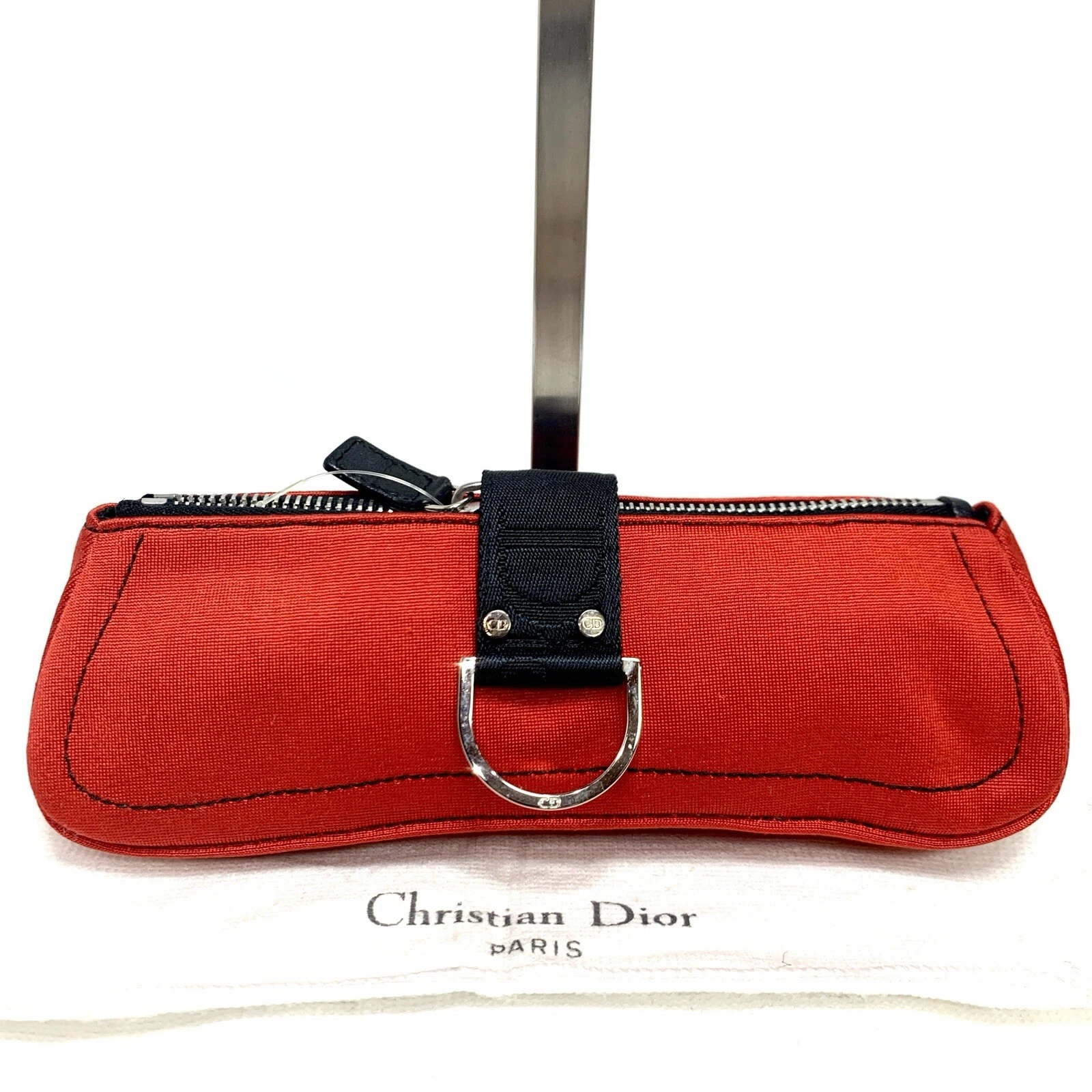 Pochette Christian Dior en toile rouge avec sac de rangement
