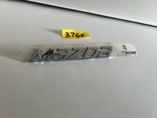 GENUINE MAZDA  EMBLEM BADGE LOGO 2014-2018 TRUNK NAMEPLATE NEW OEM BHN1-51-721