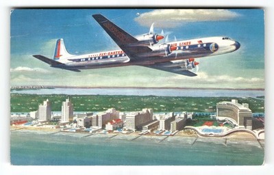 Postcard Vintage 1950s Eastern Air Lines Golden Falcon DC-7B Aerial City Chrome