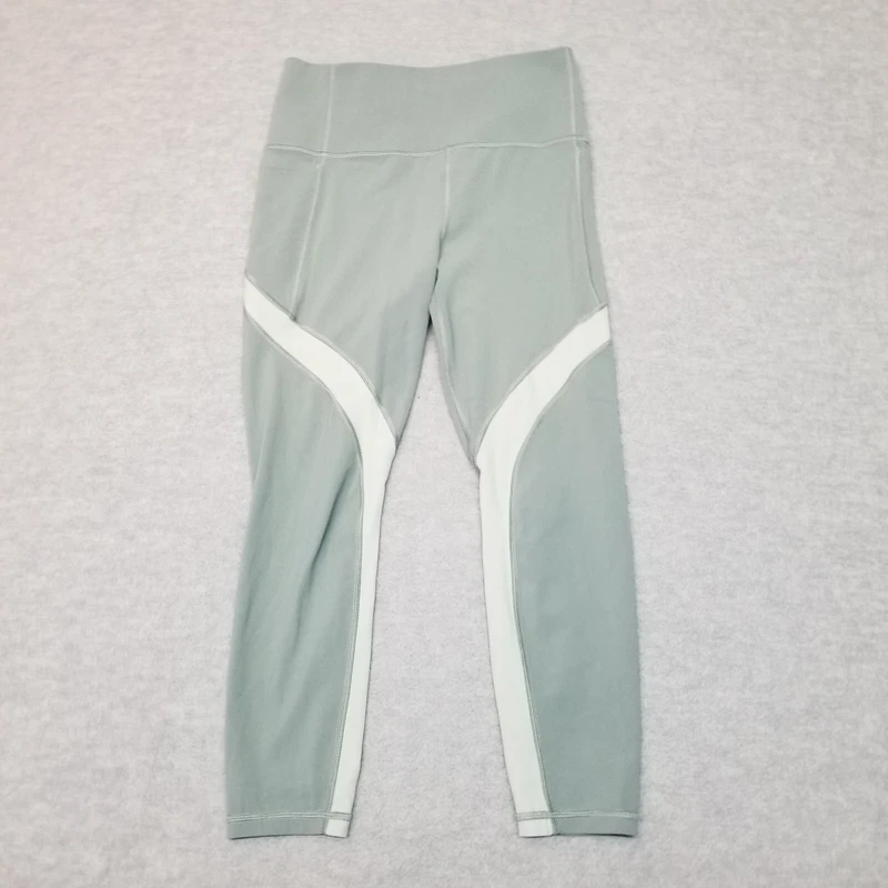 athleta salutation stash pocket 7/8 tight leggings