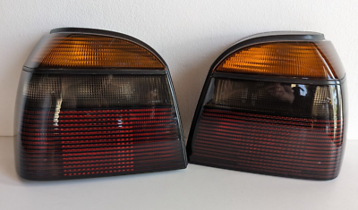 VW Golf Mk3 Smoked Facelift Tail Lights | HELLA | 1H6945111