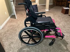 Quantum iris manual tilt and space wheelchair, pink used but great condition 